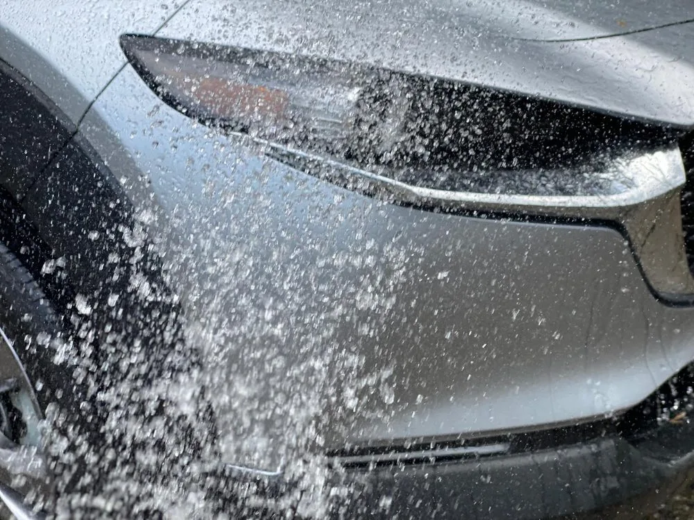 Water beading tightly on a freshly ceramic-coated panel
