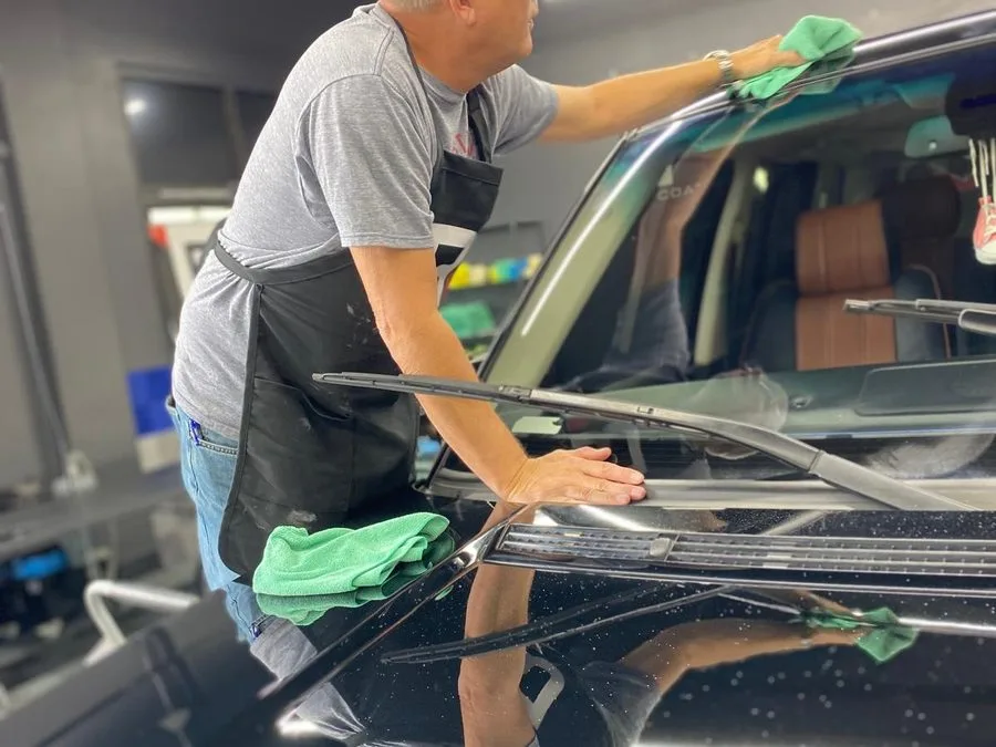 Interior glass and cabin being detailed on a customer vehicle